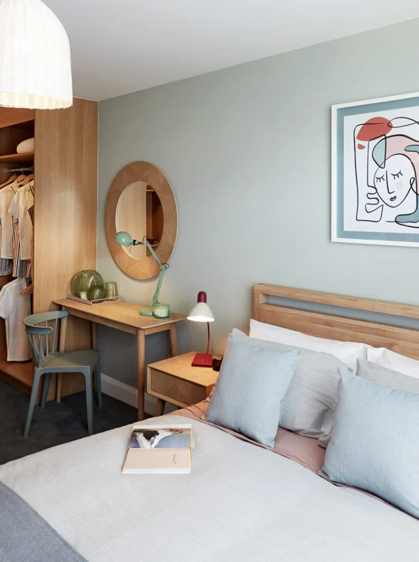 organised and tidy boy's bedroom with open wardrobe