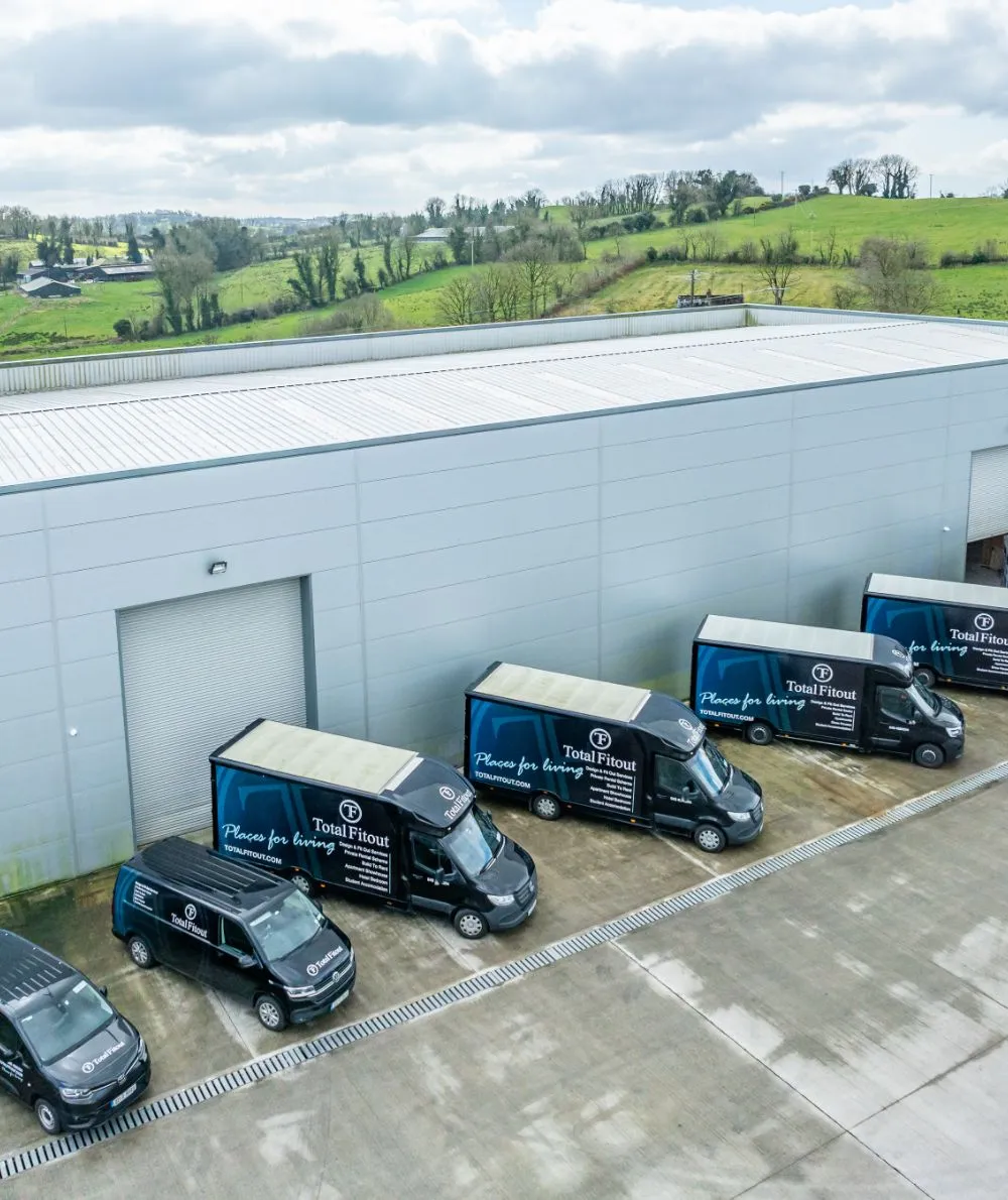 total fitout aerial view of branded trucks and cars